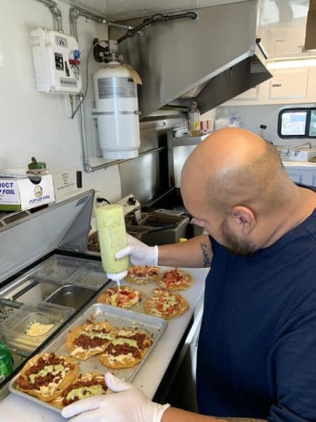 King Kups manager Bryan Acosta makes tacos. (Courtesy Jean Ann Collins) 