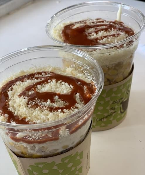 The best-selling elotes are layered with mayo, butter, crema, cheese, lime juice. (Courtesy Jean Ann Collins) 