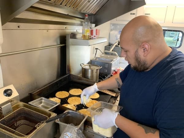 King Kups manager Bryan Acosta makes tacos. (Courtesy Jean Ann Collins) 