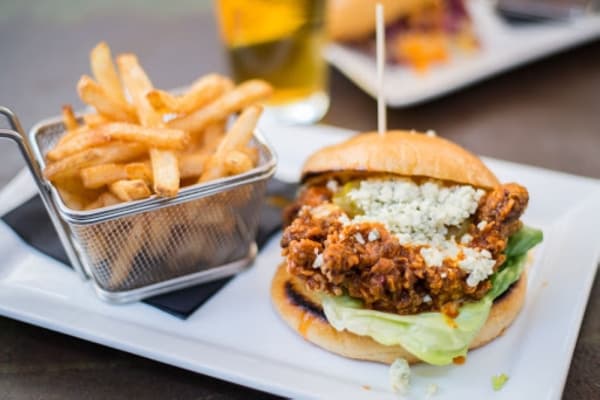 Muck & Fuss is known for its burgers and sandwiches, such as the Buffalo chicken sandwich priced at $11.95.  (Courtesy Muck & Fuss)