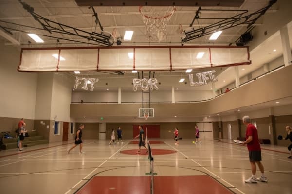 Guests mixed with visitors on the courts at Carpenter Park Recreation Center during the Rec Fest kickoff event, where guests were encouraged to take a look around and try out a sport for the night. (Liesbeth Powers/Community Impact Newspaper)