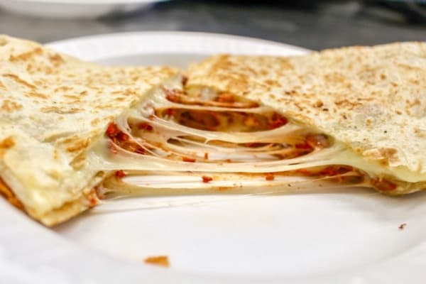 Quesadillas are served with cheese and a choice of meat. (Evelin Garcia/Community Impact Newspaper)
