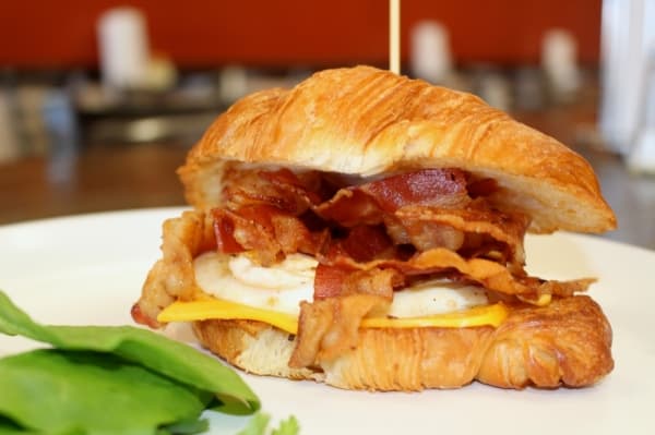World's Burgers' traditional croissant ($4.99) is served with a choice of sausage, ham or bacon along with an egg and cheese. Mexican, Caribbean and Milan varieties are also available. Ben Thompson/Community Impact Newspaper