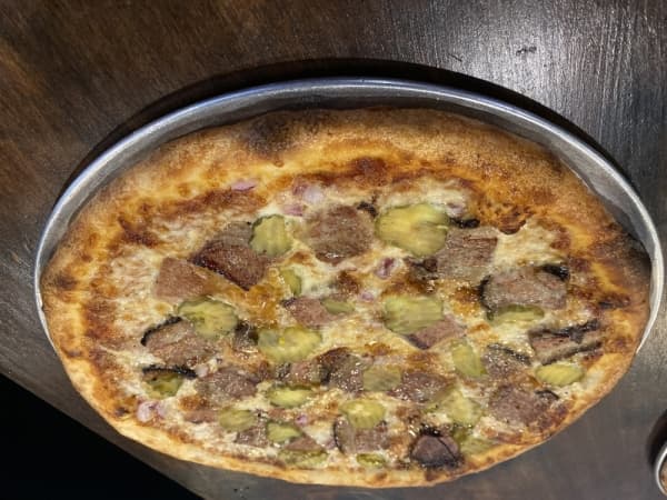 The Texas BBQ Brisket pizza is popular at Toss.