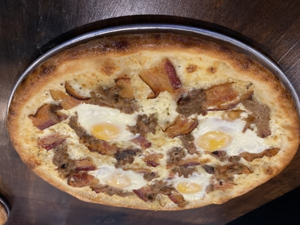 The Pulled Pork Carbonara pizza is one of Toss' more exotic menu items. 