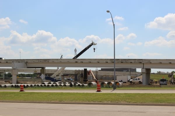 Cranes work to build new auxiliary lanes and bridges for the DFW Connector project. (Miranda Jaimes/Community Impact Newspaper)