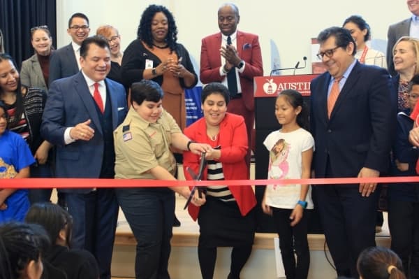 T.A. Brown Elementary School Principal Veronica Sharp cuts the ribbon to commemorate the opening of the school's modernized campus Jan. 8. Jack Flagler/Community Impact Newspaper