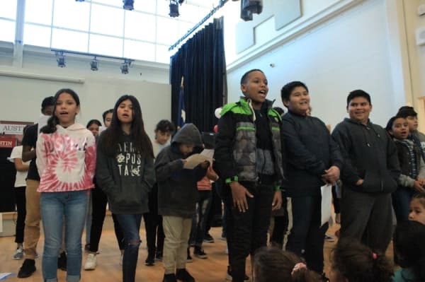 Fifth grade students at T.A. Brown Elementary School sing 'Count on Me' by Bruno Mars during the opening ceremony of the school's modernized campus on Jan. 8. Jack Flagler/Community Impact Newspaper