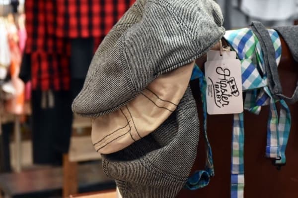 Accessories, such as hats, are also sold. (Makenzie Plusnick/Community Impact Newspaper)