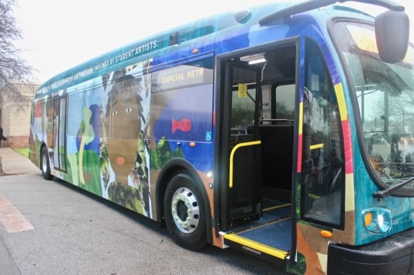 Capital Metro worked with arts-focused nonprofit Creative Action on a contest for students at Lee Lewis Campbell Elementary. Artwork from 23 students appears on the bus wraps for the two new electric buses. (Amy Denney/Community Impact Newspaper)