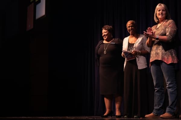 Dollie Thomas is presented with a special award for continuing to assist with the yearly diversity celebration event after retiring from Plano ISD the year before. (Liesbeth Powers/Community Impact Newspaper)