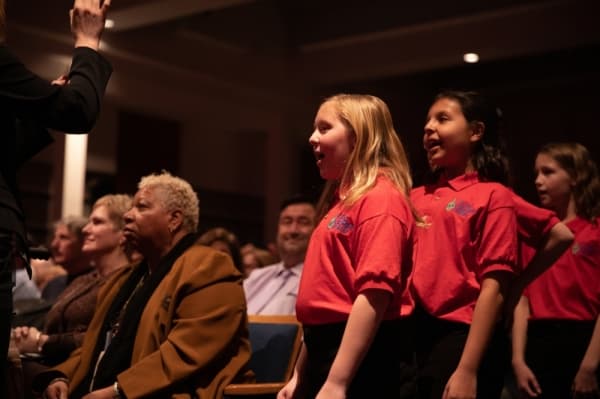 The Plano Children's Chorale joined the high school show choir finale performance, singing from the audience at the 2020 Plano ISD Diversity Celebration. (Liesbeth Powers/community Impact Newspaper)