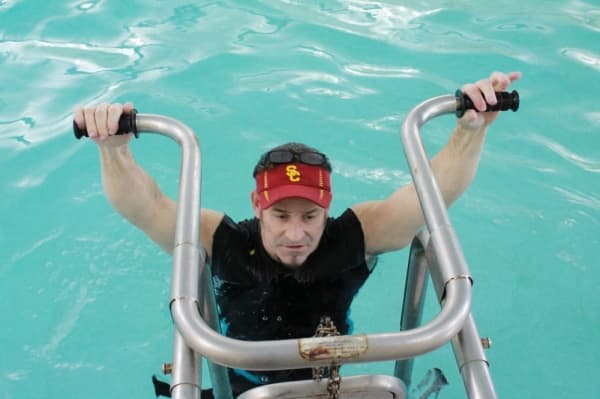 Therapists, such as Eric Hanson, help personalize aquatic exercises for patients. (Andy Li/Community Impact Newspaper)