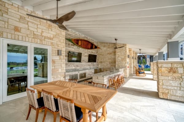 The back patio features grills and seating spaces for residents. (Courtesy The Howard Hughes Corporation)