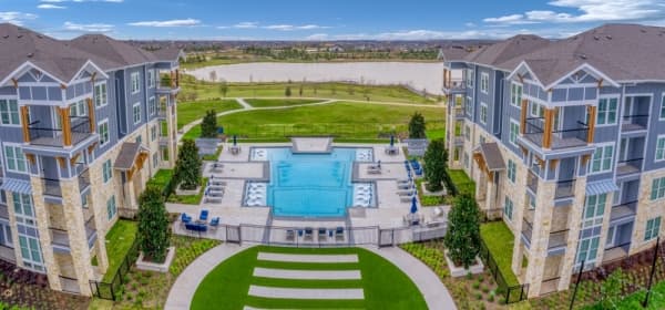 A swimming pool overlooks Josey Lake. (Courtesy The Howard Hughes Corporation)