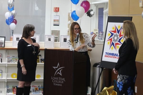 Library Janna Hoglund (middle) presented the logo for the Tomball Innovation Lab designed by Michele Patton (left). (Anna Lotz/Community Impact Newspaper)