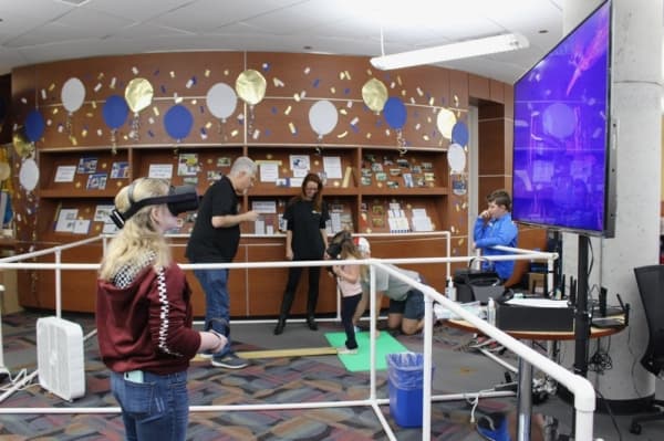 NetEdge Solutions offered virtual reality experiences during the grand opening event. (Anna Lotz/Community Impact Newspaper)