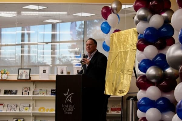 Bruce Hillegeist, president of the Greater Tomball Area Chamber of Commerce, spoke during the grand opening ceremony. (Anna Lotz/Community Impact Newspaper)