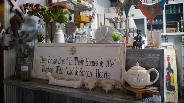 Bless This Nest's kitchen corner, in addition to its cooking-inspired gifts and decor, has a Keurig machine and snacks for visitors to enjoy while shopping. (Kelsey Thompson/Community Impact Newspaper)                                                             