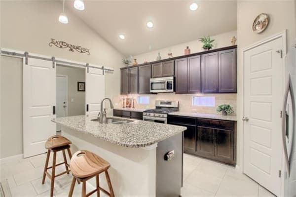 This home, built in 2016, features granite countertops and stainless steel appliances. 
