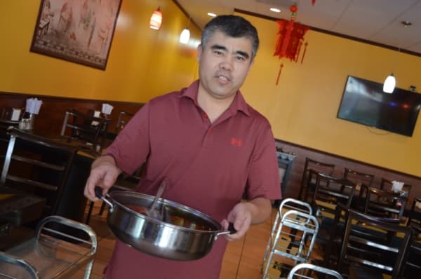 Thomas Li opened Li Hot Pot & BBQ in September 2018. Li worked in other Austin-area restaurants shortly after he immigrated to the U.S. (Iain Oldman/Community Impact Newspaper)