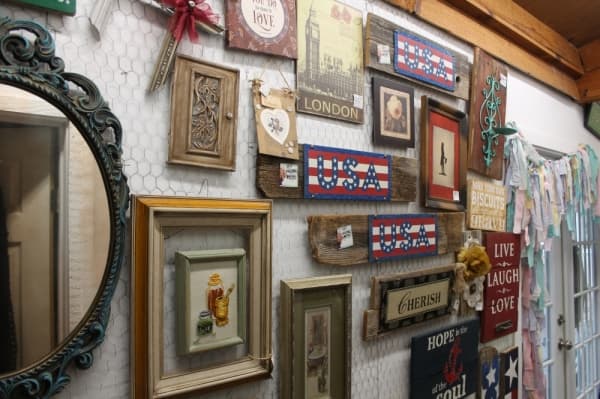 Kelly likes to take picture frames and other small items and refurbish them with paint and wood. (Jake Magee/Community Impact Newspaper)