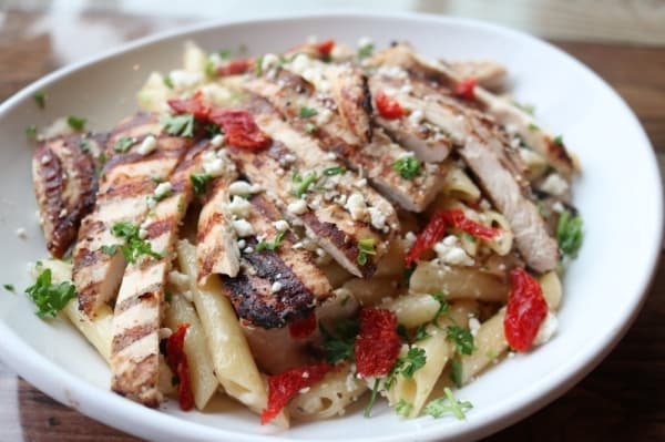Penne Milano ($16.59) is penne pasta with sun-dried tomatoes, feta cheese and basil; sauteed with olive oil and garlic sauce; and topped with grilled chicken.