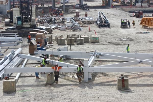 These white beams will be the support for the roof canopy that is scheduled to be erected this summer. (Amy Denney/Community Impact Newspaper)