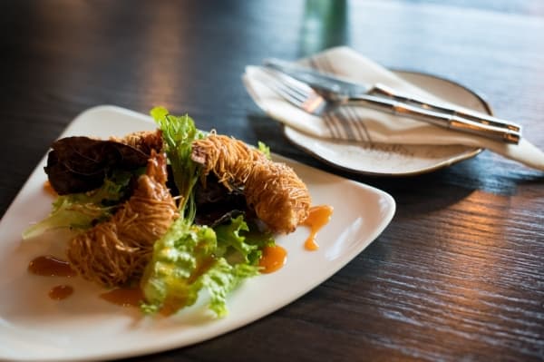 Kataifi-wrapped shrimp ($13.95): Shrimp are stuffed with bacon and wrapped in a crispy noodle pastry with a sweet and spicy sauce.