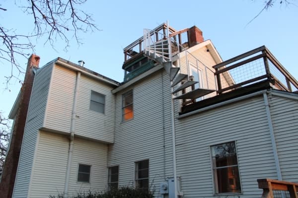 A set of stairs leads up to a balcony on top of the house. (Photo by Anna Herod/Community Impact Newspaper)