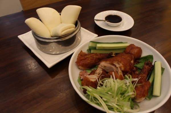 Peking Duck (half-size $20, full-size $40): Roasted duck served with fresh spring onions, cucumbers, hoisin sauce and lotus buns. (Elizabeth Ucles/Community Impact Newspaper)