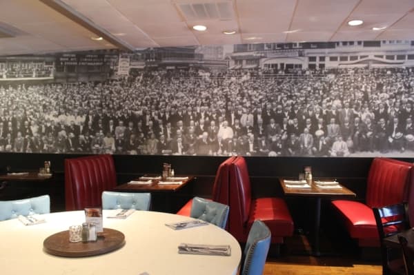 The mural depicted on the walls of every League Kitchen & Tavern location features a photo of the Prohibition lobbyist organization the Anti-Saloon League. (Amy Rae Dadamo/Community Impact Newspaper) 