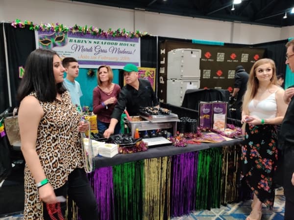 Representatives from Babin’s Seafood House in Shenandoah served up plates of the rice-based dish jambalaya at their themed booth at the Taste of the Town event. (Ben Thompson/Community Impact Newspaper)