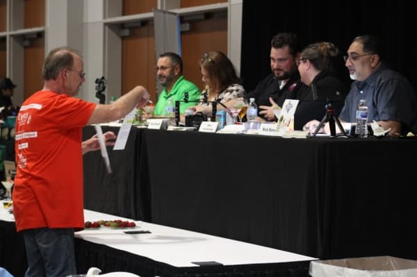A panel of judges reviewed several categories of food submitted by local restaurants for competition, such as appetizers, entrees and desserts. (Andrew Christman/Community Impact Newspaper)