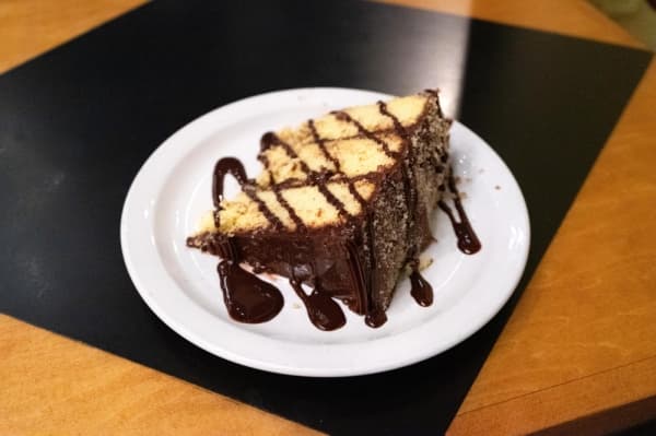 Tollhouse crunch cake ($7.95, half price on Mondays): one of 15 varieties of cake; yellow cake with chocolate chips and chocolate icing dusted with sugar