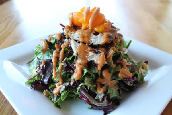 The Thai chicken salad ($12.50) is served with roasted chicken and mandarin oranges and topped with lime vinaigrette and Thai curry sauce.