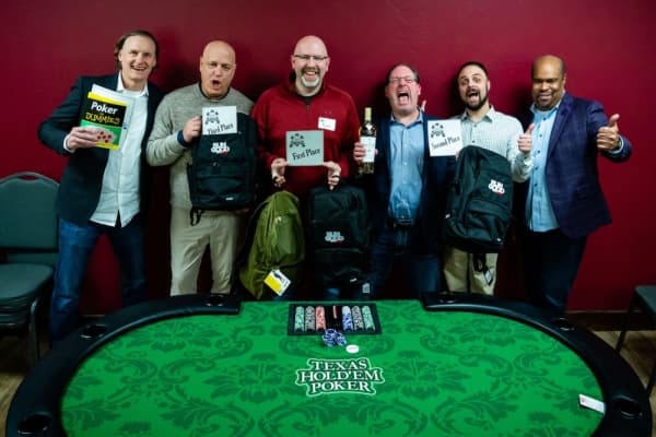 The winners of the poker tournament helped raise money for the GRACE nonprofit relief agency. (Courtesy Corey Collins)
