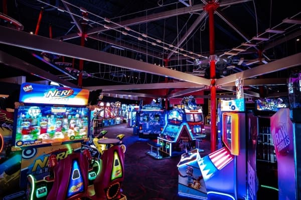The entertainment venue has a game room with video and arcade games. (Courtesy Pinstack)