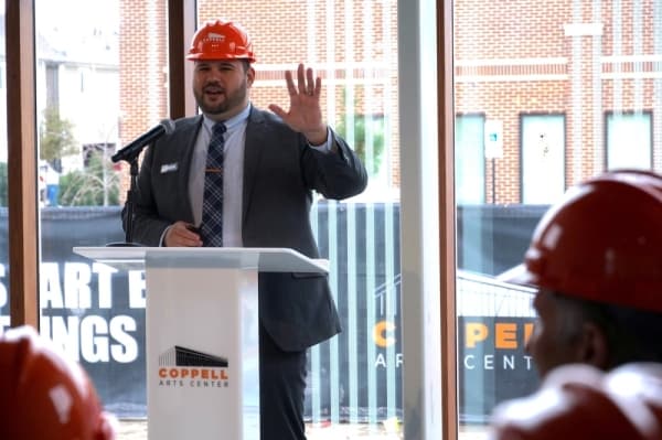 Coppell Arts Center Managing Director Alex Hargis announces the grand opening event details, including the May 15 headline performance from Tony Award-winner Kristin Chenoweth. (Gavin Pugh/Community Impact Newspaper)