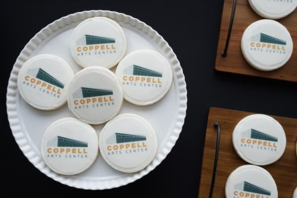 Cookies served during the hardhat tour feature the facade of the soon-to-open arts center. (Gavin Pugh/Community Impact Newspaper)
