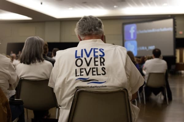 Kingwood/Lake Houston residents wore 'Lives over levels' T-shirts. (Trevor Nolley/Community Impact Newspaper)