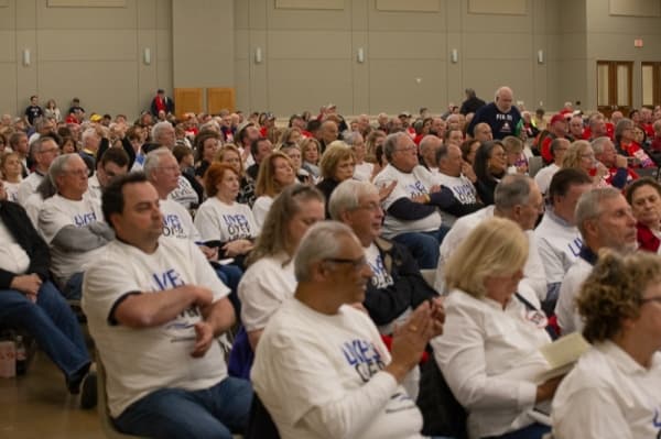Kingwood/Lake Houston residents wore 'Lives over levels' T-shirts. (Trevor Nolley/Community Impact Newspaper)