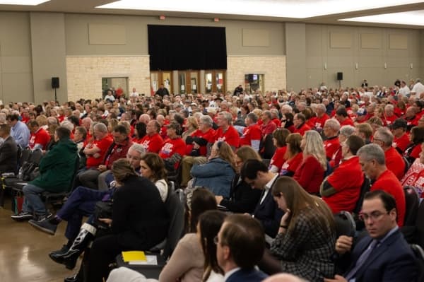 Lake Conroe residents wore red 'Stop the drop' T-shirts. (Trevor Nolley/Community Impact Newspaper)