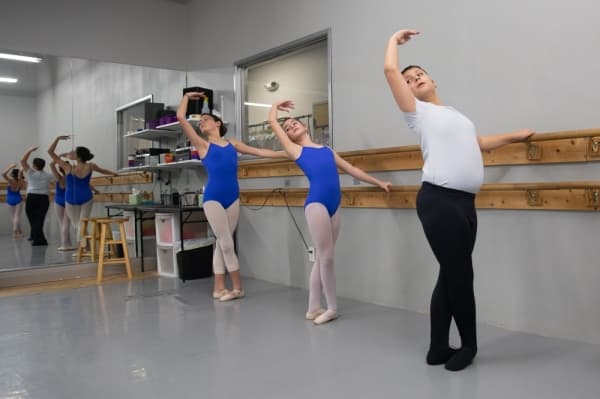 The academy's Level IV ballet students take classes three days a week and female Level IV students work toward transitioning into pointe shoes. (Liesbeth Powers/Community Impact Newspaper)