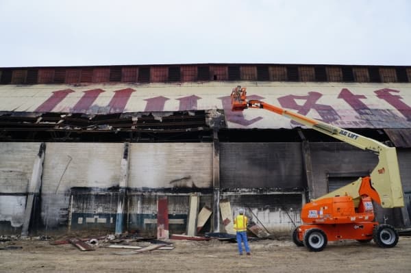 Damaged panels on the Wurstahlle roof are removed to make improvements to interior structural beams. (Lauren Canterberry/Community Impact Newspaper)