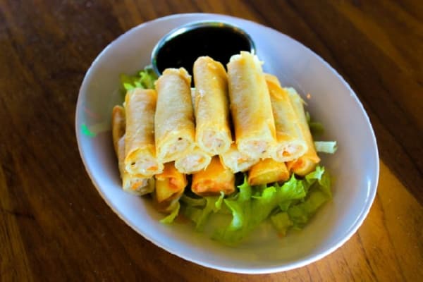 Shanghai Lumpia: $8.75•This Filipino roll features pork and shrimp wrapped in pastry, served with sweet chili sauce.