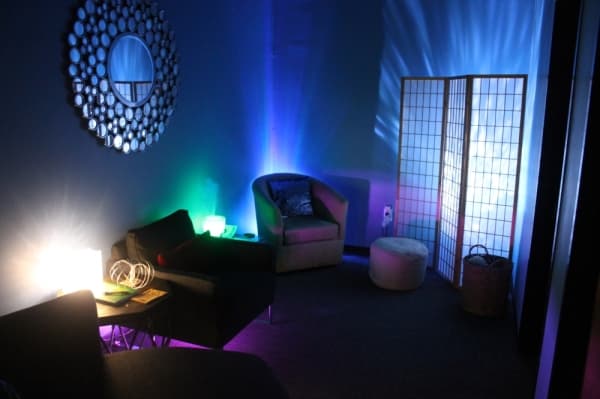 The business features several dimly lit lounges for customers to relax in. (Jake Magee/Community Impact Newspaper)