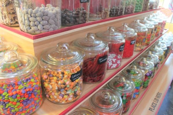 The shop features jars of gumballs, candied fruit, candied nuts and other candies customers can purchase by weight. (Carrie Taylor/Community Impact Newspaper)