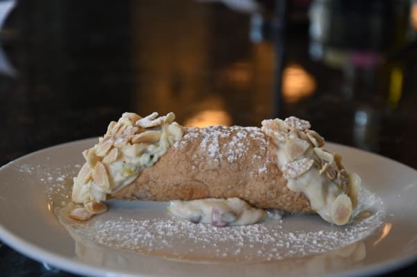 Cannoli ($6.50) is filled with sweetened ricotta & citron, dusted with powdered sugar & toasted almond slices.