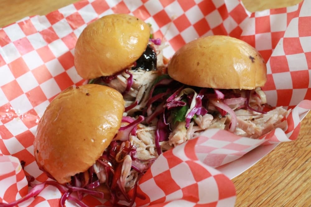 Patrons can order a plate with brisket, jalapeno cheese sausage, brisket burnt ends and black pepper sausage. (Andy Li/Community Impact Newspaper)
